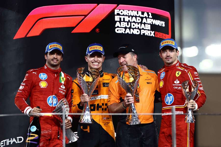Lando Norris and McLaren chief executive Zak Brown with their trophies