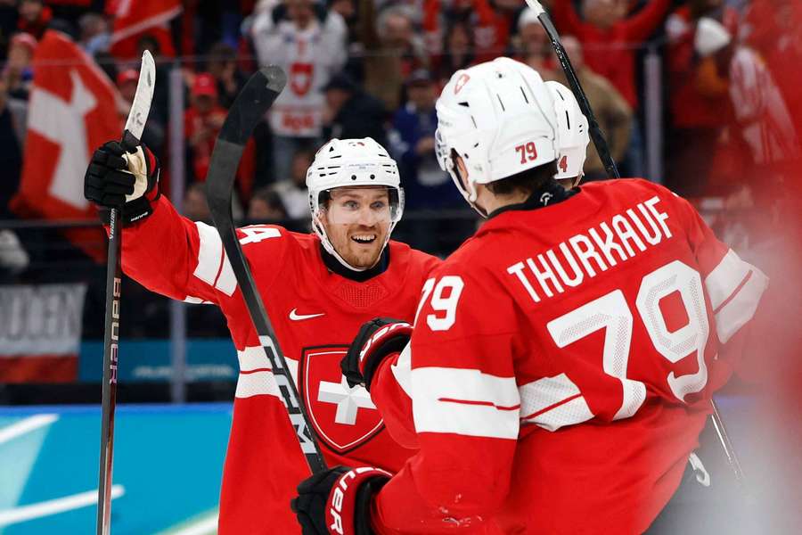 Dean Kukan of Switzerland celebrates scoring their fourth goal with Calvin Thurkauf and Pius Suter Dean Kukan of Switzerland celebrates scoring their fourth goal with Calvin Thurkauf and Pius Suter