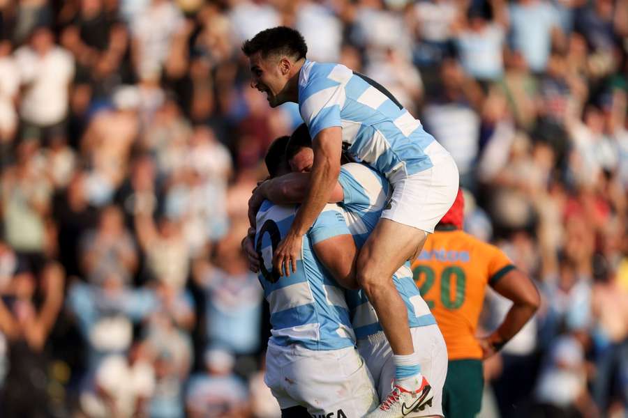 Argentina's Los Pumas Joaquin Oviedo, left, celebrates scoring a try against Australia with teammate Marcos Kremer