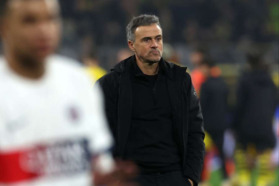 Luis Enrique walks off the pitch after PSG drew to Dortmund to secure qualification to the last 16 of the Champions League