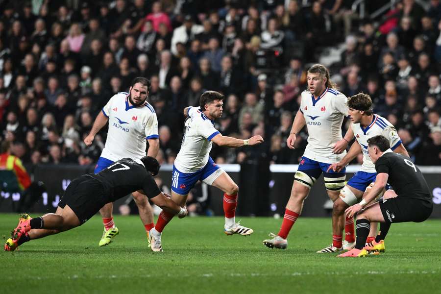French back Matthieu Jalibert runs with the ball against New Zealand. French back Matthieu Jalibert runs with the ball against New Zealand.