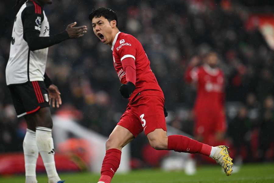Liverpool's Japanese midfielder #03 Wataru Endo celebrates after scoring their third goal
