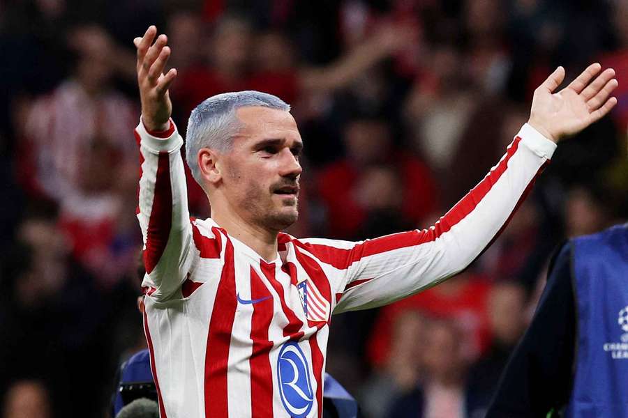 Atletico Madrid's Antoine Griezmann celebrates after progressing to the Round of 16