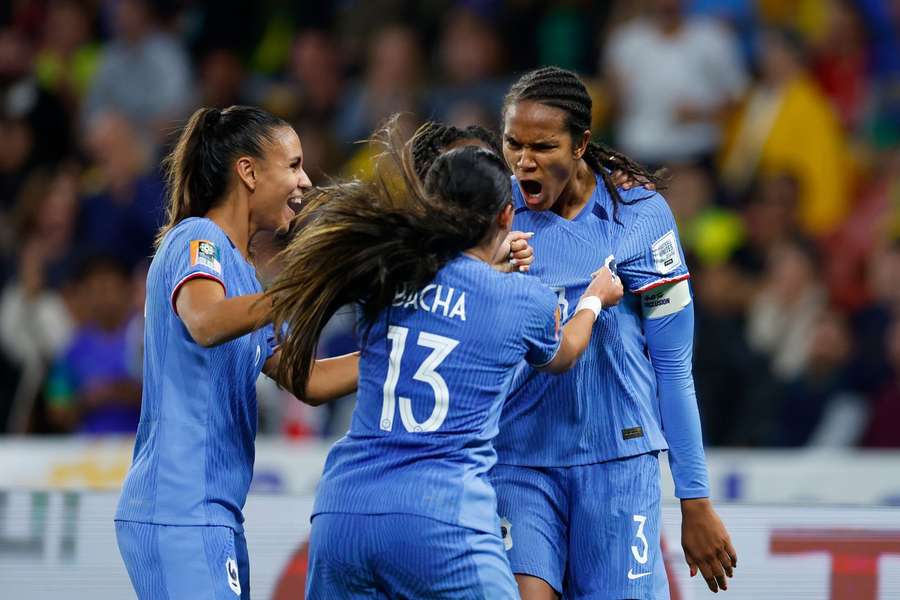 Wendie Renard celebrates with teammates after scoring France's second goal