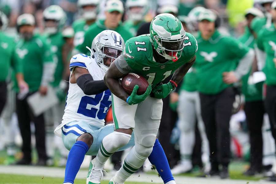 A.J. Brown of the Philadelphia Eagles (R) shakes off the Cowboys' DaRon Bland during their last meeting in the 2024 season