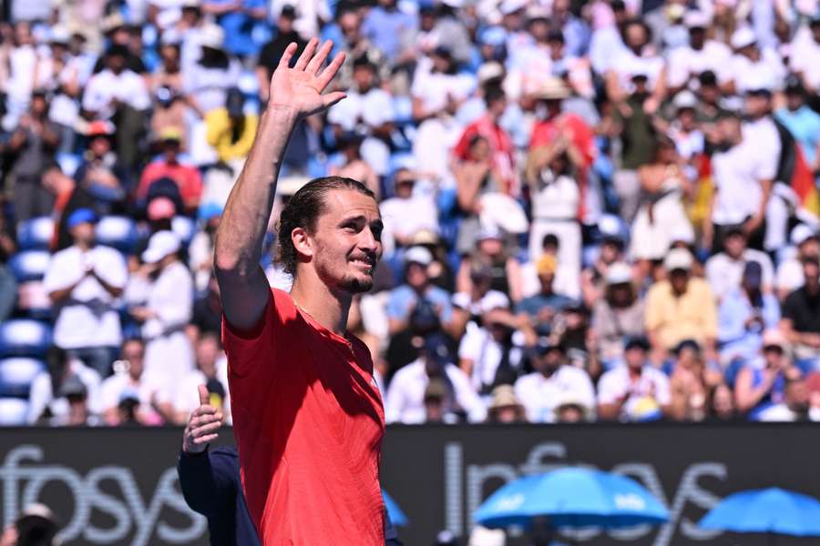 Alexander Zverev acknowledges the fans after Novak Djokovic retired from their semi-final