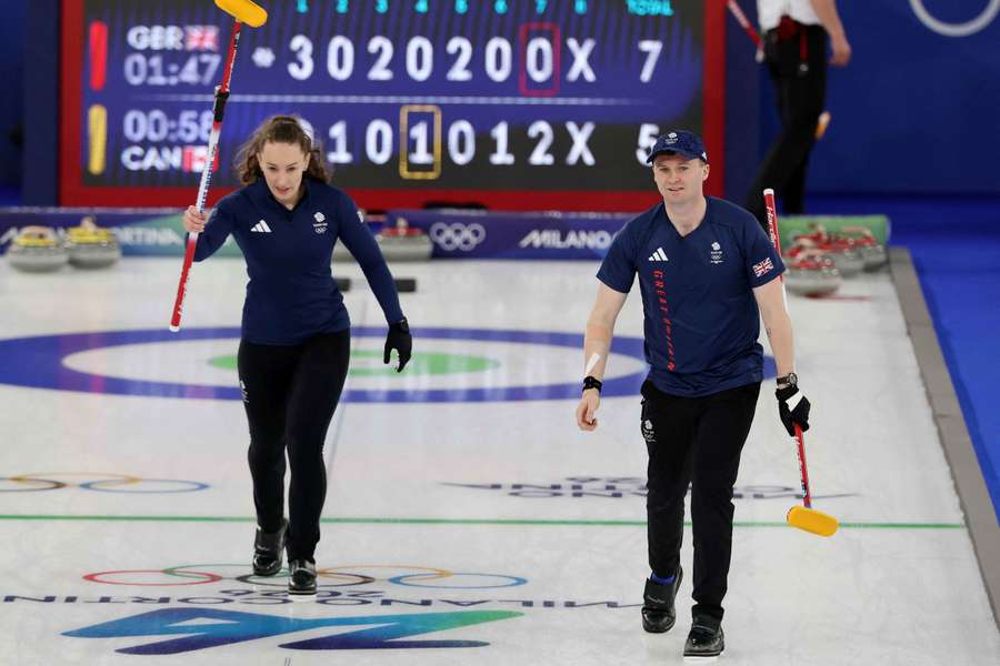 Bruce Mouat and Jennifer Dodds of Great Britain celebrate winning against Canada