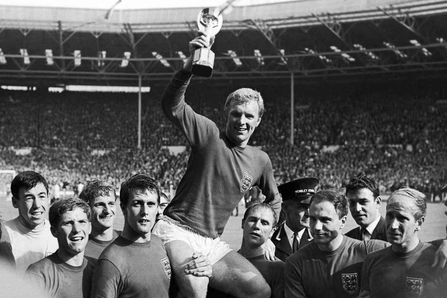 England captain Bobby Moore holds the World Cup trophy aloft on July 30, 1966. 
