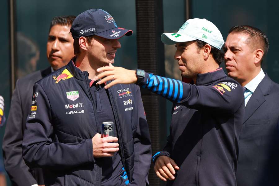 Verstappen (L) alongside teammate Sergio Perez