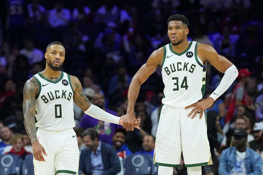 Damian Lillard (left) celebrates with Giannis Antetokounmpo