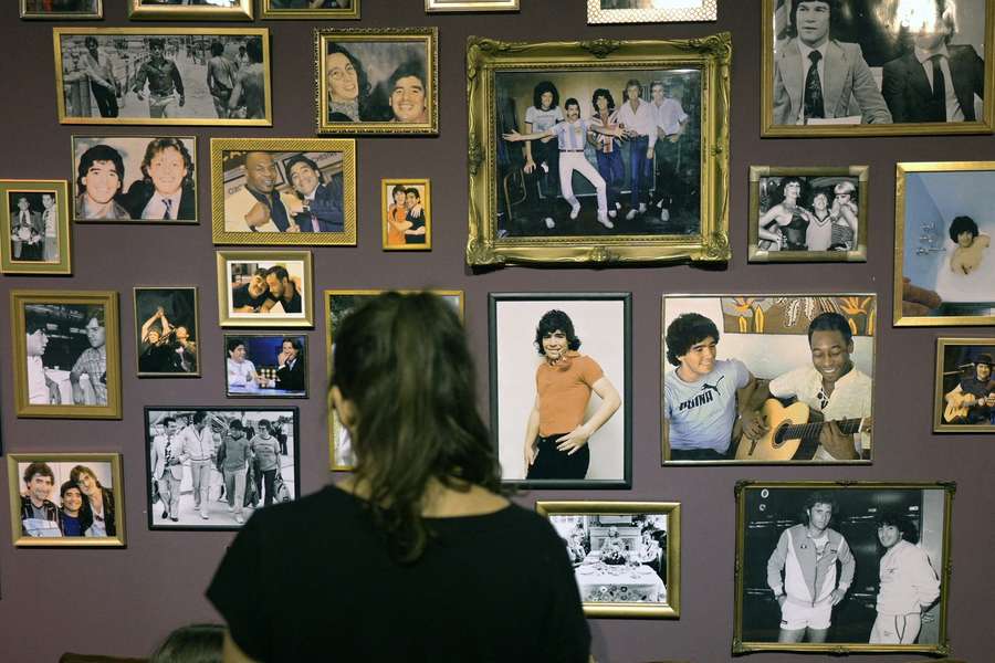 Photos of Diego Maradona with celebrities are seen at the exhibition 