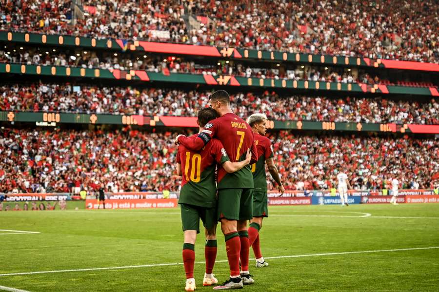 Bernardo Silva celebrates with Cristiano Ronaldo after scoring for Portugal against Bosnia-Herzegovina