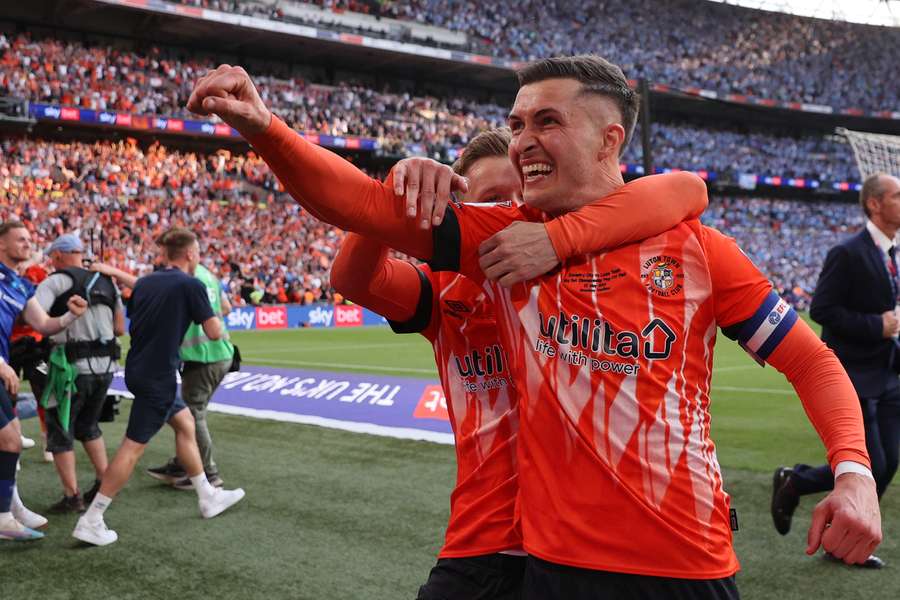 Dan Potts celebrates after Luton beat Coventry on penalties