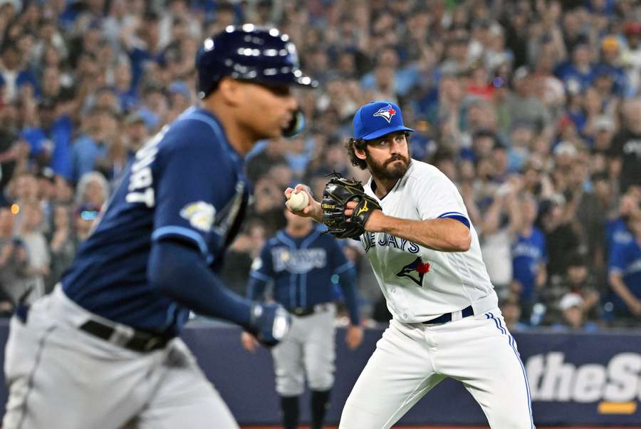 Blue Jays relief pitcher Romano prepares to throw out Rays catcher Bethancourt