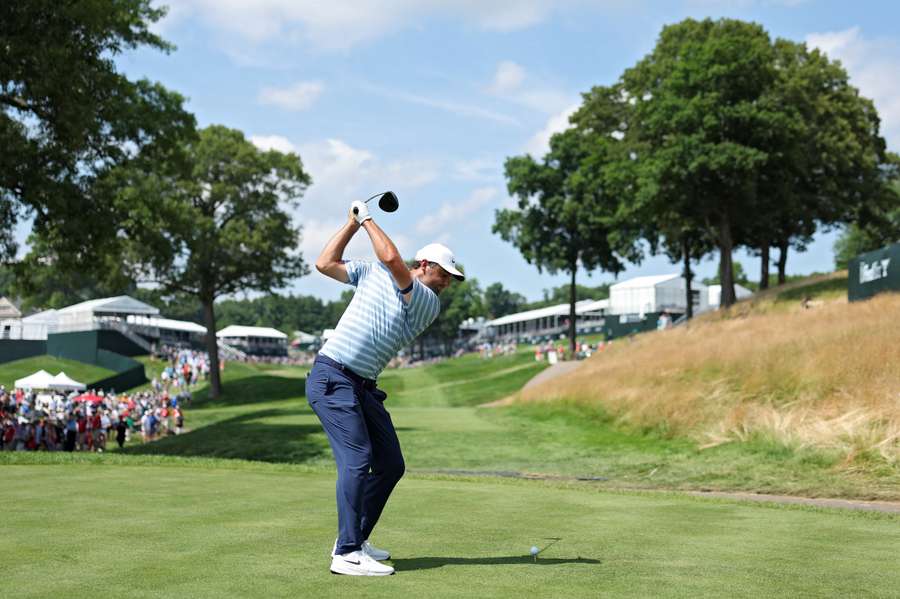 Scottie Scheffler playing a shot from the 18th on Friday.
