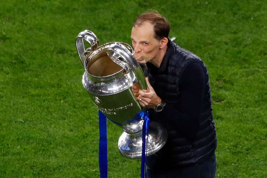 Thomas Tuchel celebrates with the trophy after winning the UEFA Champions League with Chelsea