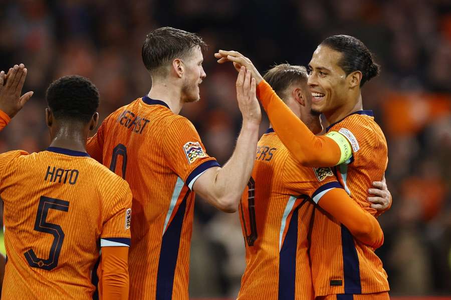 Wout Weghorst, Teun Koopmeiners and Virgil van Dijk of the Netherlands celebrate their fourth goal