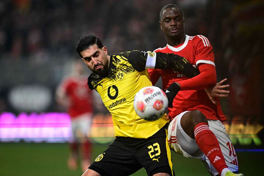 Dortmund goalscorer Emre Can battles for the ball with Ilyas Ansah Dortmund goalscorer Emre Can battles for the ball with Ilyas Ansah