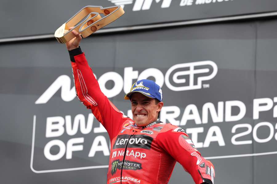 Marc Marquez celebrates on the podium after winning the Austrian Grand Prix