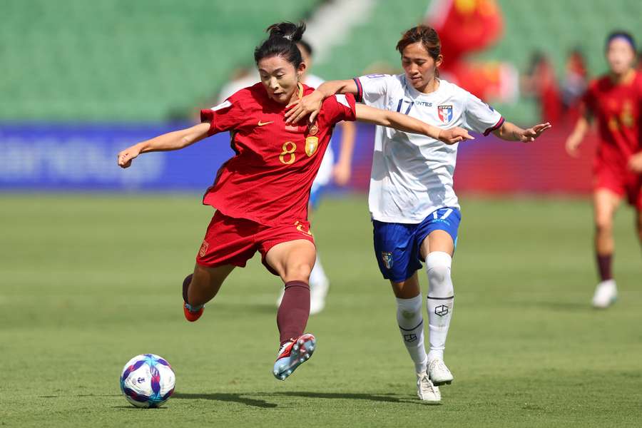 Yao Wei of China battles for the ball