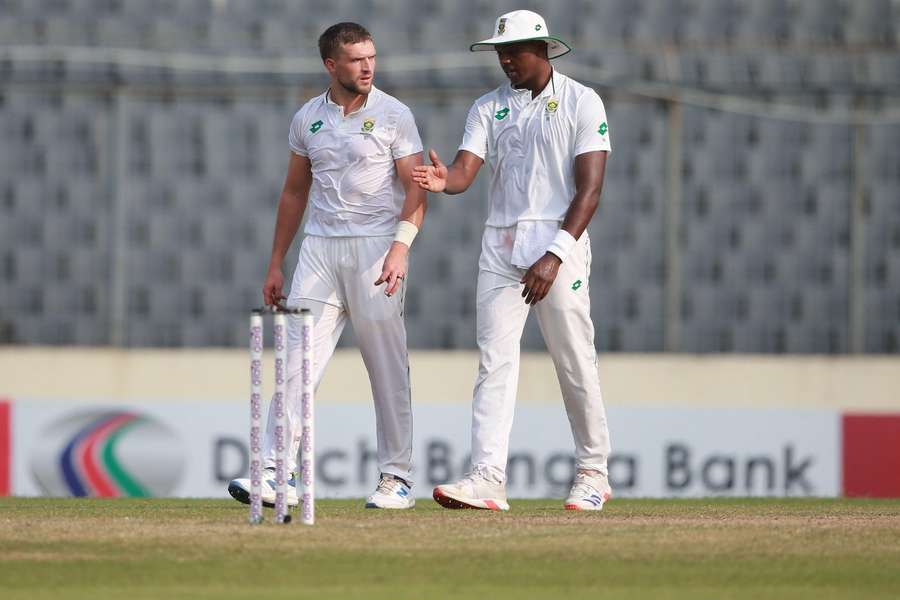 South Africa's Wiaan Mulder and Kagiso Rabada, right