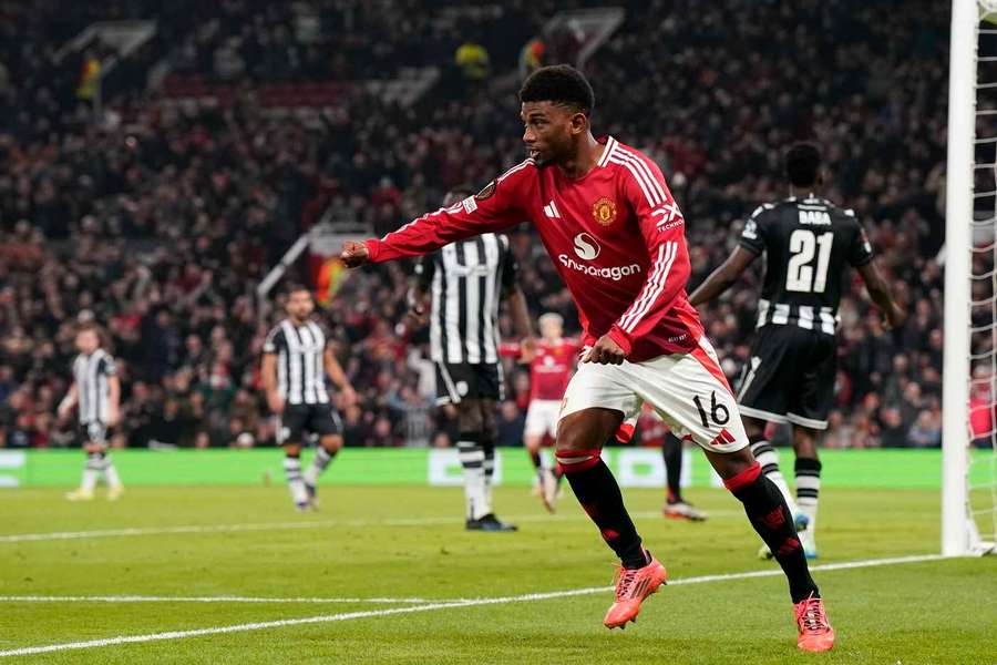 Amad Diallo wheels away after netting Manchester United's opener