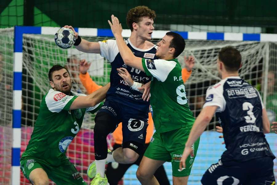 Oli Mittun from GOG and Pavle Atanasojevic from HC Pelister tussle for thee ball during Champions League match