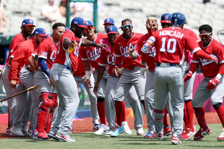 Team Cuba celebrates after Yoan Moncada (#10) home run at 2026 World Baseball Classic