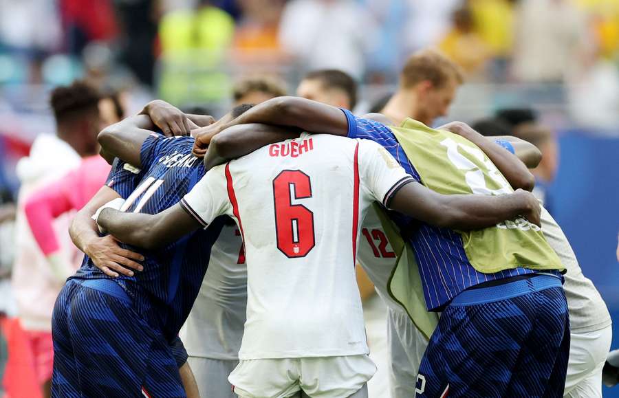 England's and France's players meet at the end of the game England's and France's players meet at the end of the game