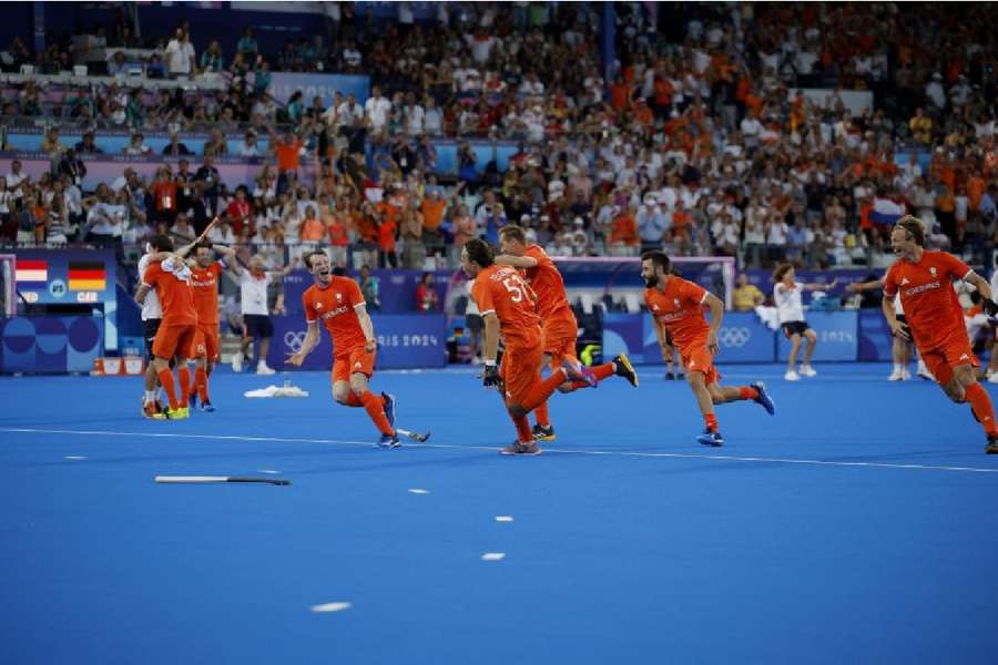 The Dutch players celebrate their win