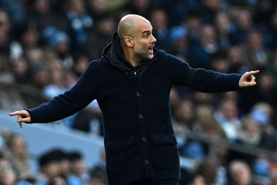 Manchester City's Spanish manager Pep Guardiola gestures on the touchline during the match between Manchester City and Aston Villa 