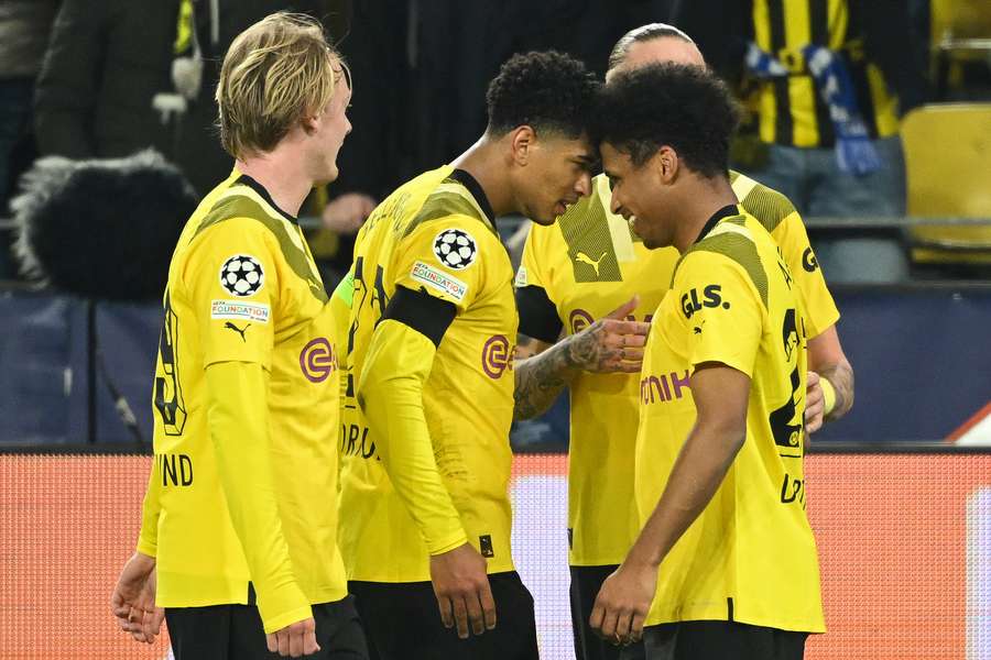 Dortmund's German forward Karim Adeyemi celebrates scoring the opening goal with his teammates 