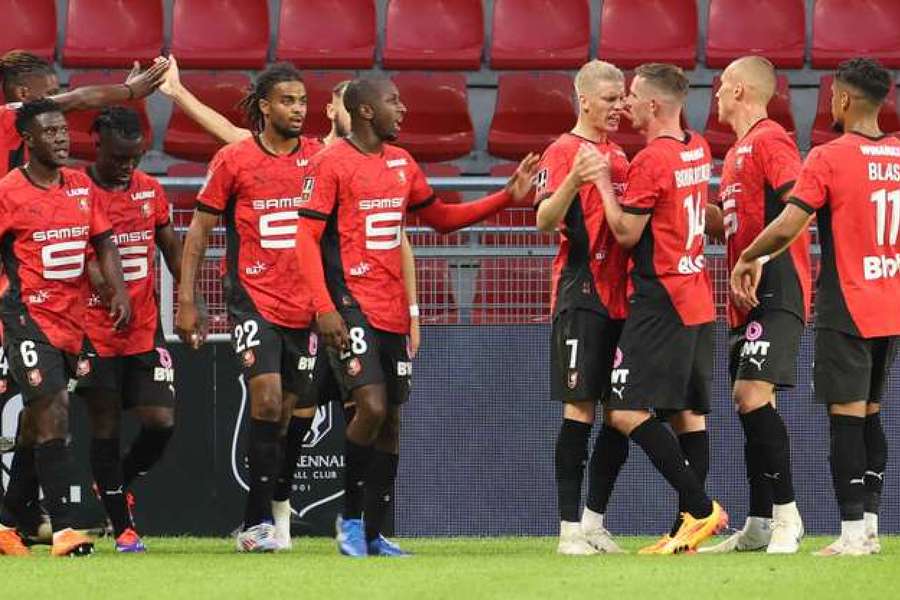 Rennes players celebrate together