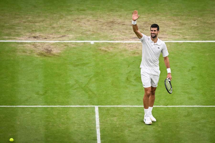 Novak Djokovic celebrates winning against Jannik Sinner