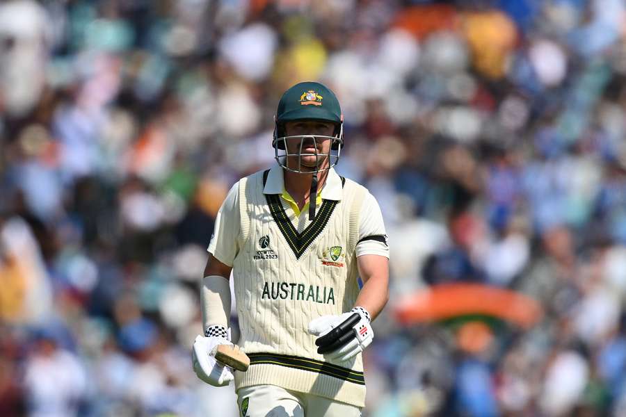 Australia's Travis Head walks back to the pavilion after losing his wicket for 163 runs