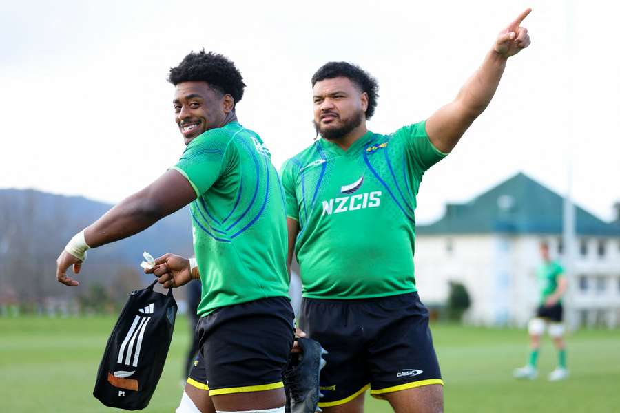 Peter Lakai and Pasilio Tosi share a laugh during a Wellington Hurricanes training session.