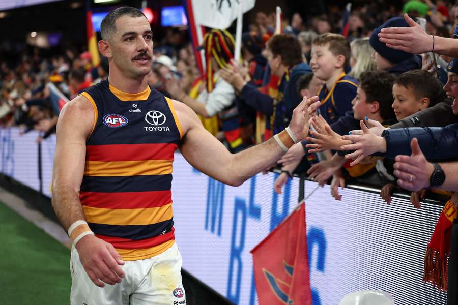 Taylor Walker will on Thursday become the 110th man to notch up 300 V/AFL games.