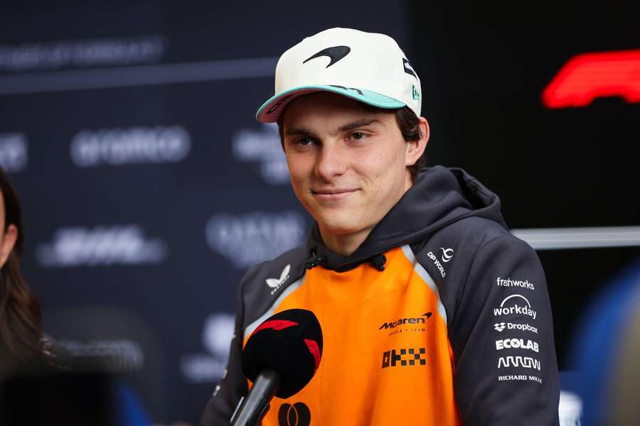 Oscar Piastri speaks with reporters