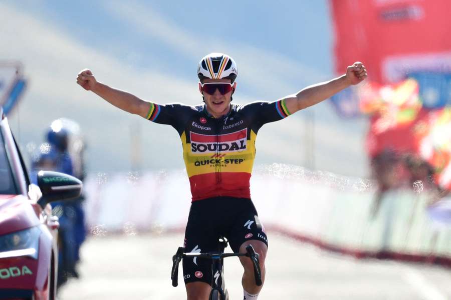 Remco Evenepoel celebrates winning stage 14