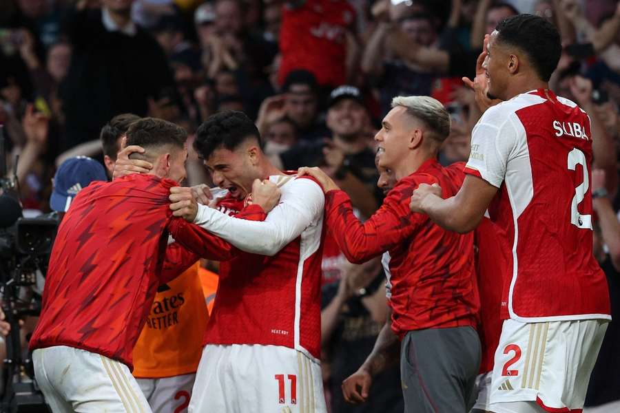 Arsenal's players celebrate their win