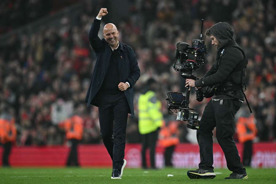 Liverpool's Dutch manager Arne Slot celebrates after the English Premier League football match between Liverpool and Aston Villa