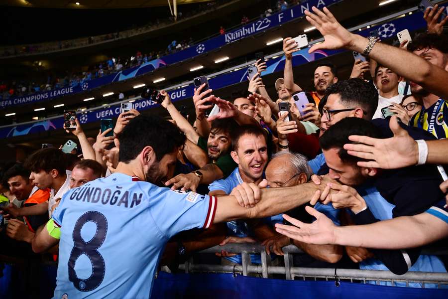 Gundogan with fans following the Champions League win