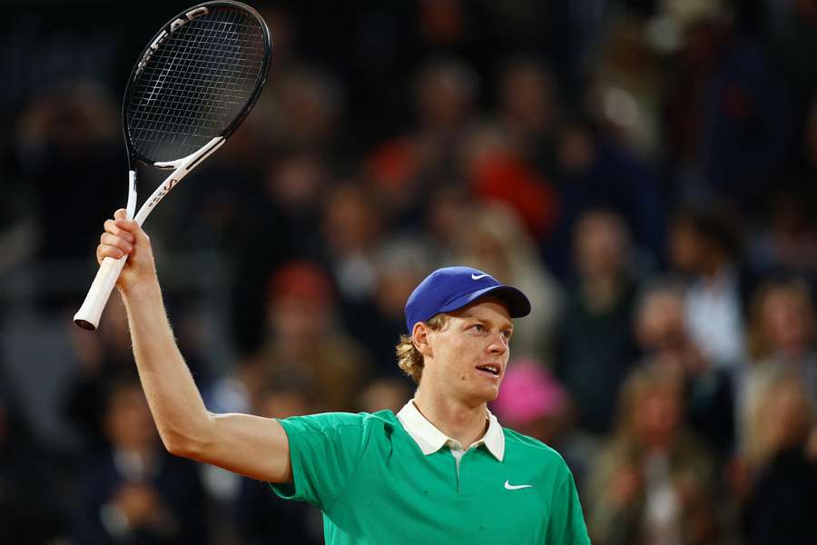 Jannik Sinner salutes the crowd after winning the semi-final