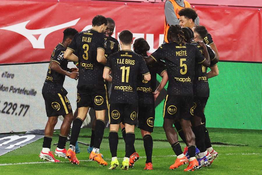 Lorient celebrate their first goal of the game