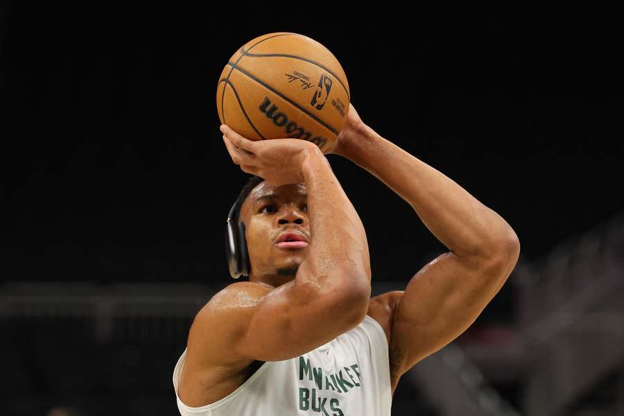 Giannis Antetokounmpo warms up for the Bucks