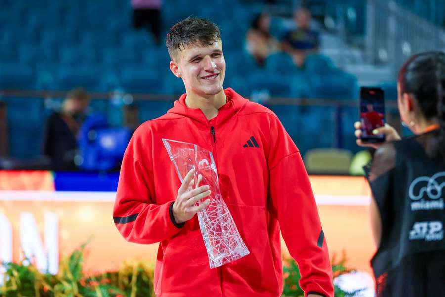 Mensik with his trophy