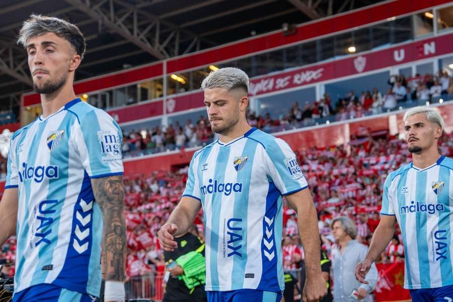 David Larrubia, Dani Lorenzo e Chupe antes de entrarem em campo no Almería-Málaga