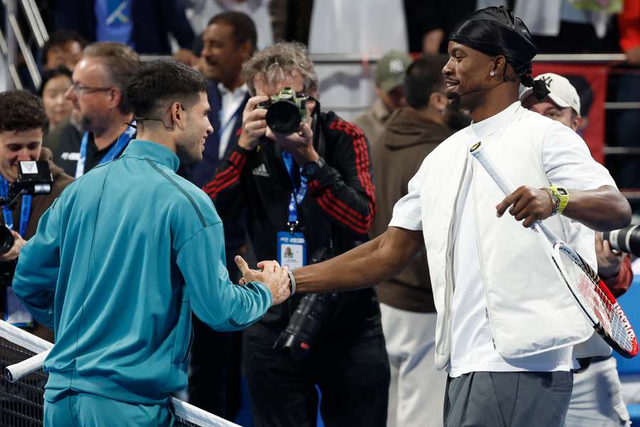 Alcaraz (left) shakes hands with Butler