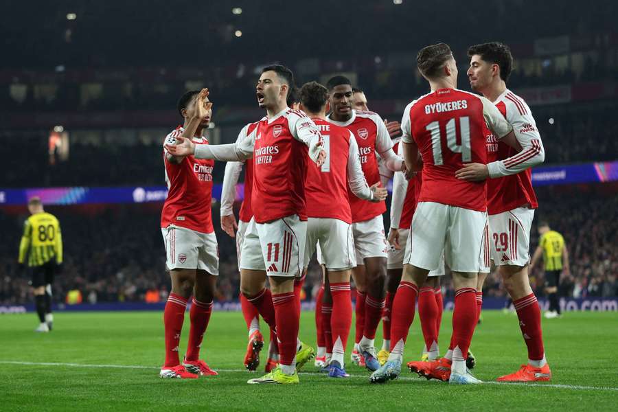 Arsenal topped the Champions League table by winning all eight of their games