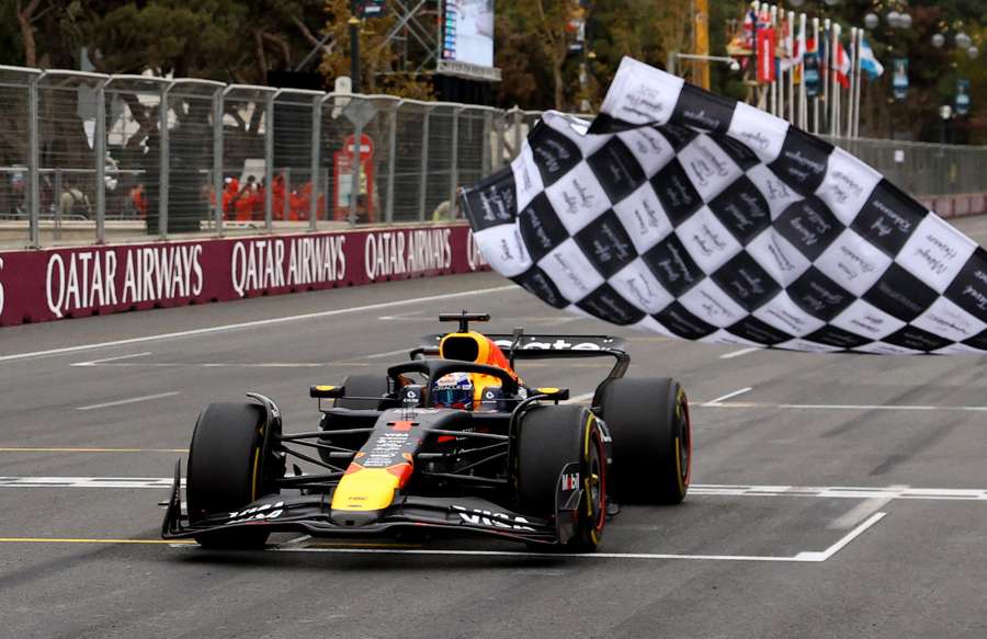 Red Bull's Max Verstappen passes the chequered flag to win the Azerbaijan Grand Prix Red Bull's Max Verstappen passes the chequered flag to win the Azerbaijan Grand Prix